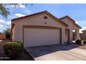 Charming single story home with a two car garage, desert landscaping, and a cozy front porch at 2635 W Atlanta Ave, Phoenix, AZ 85041