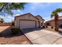 Charming single story home with a two car garage, desert landscaping, and a cozy front porch at 2635 W Atlanta Ave, Phoenix, AZ 85041