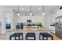 Spacious kitchen with a large island, stainless steel appliances, and pendant lighting at 26391 N 79Th Dr, Peoria, AZ 85383