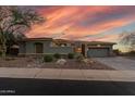 Beautiful home exterior featuring desert landscaping, a paved driveway, and a two car garage at 3045 W Feather Sound Dr, Phoenix, AZ 85086