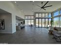 Spacious living room with open floor plan, high ceilings, and large windows with views at 3502 S Kings Ranch Rd, Gold Canyon, AZ 85118