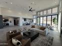 Open-concept living space with modern furniture, high ceilings, and scenic views at 3502 S Kings Ranch Rd, Gold Canyon, AZ 85118