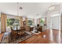 Open-concept living space with hardwood floors, lots of natural light, and neutral décor at 3750 E Palm St, Mesa, AZ 85215
