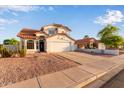 Well-maintained home showcasing a terracotta roof, neutral stucco, complemented by the neatly kept front yard at 4049 E Arbor Ave, Mesa, AZ 85206