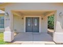 Covered front entryway featuring double doors, decorative lights, and a well-maintained walkway at 4112 N 4Th Ave, Phoenix, AZ 85013
