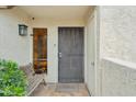 Welcoming front entrance with security door, side light, bench, and a 'Welcome To Our Home' door mat at 5224 S Monaco Dr, Tempe, AZ 85283
