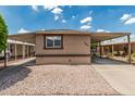 Charming single-story home with covered parking and desert landscaping at 6812 N Polk St # 223, Phoenix, AZ 85043