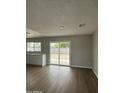 Open living area with sliding glass doors leading to the backyard patio at 7007 S 45Th Pl, Phoenix, AZ 85042