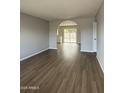 Spacious living room with new wood flooring and archway leading to backyard at 7007 S 45Th Pl, Phoenix, AZ 85042