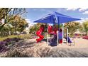 Community playground area with colorful play structures, ideal for entertainment and outdoor fun at 7842 W Tether Trl, Peoria, AZ 85383