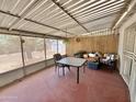 Inviting screened-in patio offering a comfortable seating area, ideal for relaxation and enjoying the outdoors at 8502 N 26Th Ave, Phoenix, AZ 85021