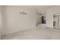 Bright living room featuring neutral carpet, and access to other rooms at 1402 E Guadalupe Rd # 215, Tempe, AZ 85283
