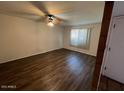 Living room with ceiling fan and laminate floors at 1718 E Gaylon Dr, Tempe, AZ 85282