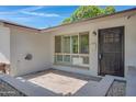 Close up of front porch with stone pavers and a black metal security door at 2510 W Columbine Dr, Phoenix, AZ 85029