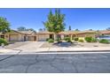 Charming single-story home with a well-manicured, low maintenance front yard and private two car garage at 2845 E Irwin Ave, Mesa, AZ 85204