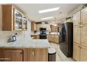 Spacious kitchen with granite counters, stainless steel appliances, and light wood cabinets at 3301 S Goldfield Rd # 1010, Apache Junction, AZ 85119