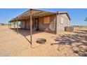 Exterior shot with a covered front awning, offering shade and curb appeal to this single-Gathering home at 43884 W Padilla Rd, Maricopa, AZ 85138