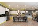 Bright and spacious kitchen features a large center island, modern stainless steel appliances, and ample cabinet space at 5123 S Mariposa Dr, Gilbert, AZ 85298