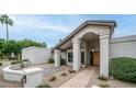 Front exterior showcasing a decorative stone pathway and pillars, and desert landscaping at 5438 E Lupine Ave, Scottsdale, AZ 85254