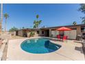 Beautiful backyard pool area with ample patio space for entertaining at 7604 N 46Th Ave, Glendale, AZ 85301
