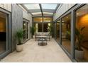 Bright sunroom features tile flooring, skylights, and sliding glass doors, creating an indoor-outdoor living space at 7604 N 46Th Ave, Glendale, AZ 85301