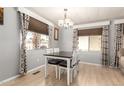 Inviting dining space with a modern table set and patterned curtains at 7807 E Main St # Cc-71, Mesa, AZ 85207