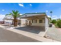 Charming single-story home featuring a covered carport and low-maintenance landscaping at 7807 E Main St # Cc-71, Mesa, AZ 85207