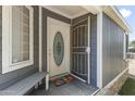 Exterior of the home with a white front door and storm door at 8111 E 5Th Ave, Mesa, AZ 85208
