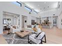 Open-concept living room with high ceilings connecting to kitchen and dining area at 8300 E Dixileta Dr # 306, Scottsdale, AZ 85266
