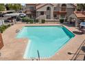 Swimming pool offers a clean, inviting community space with steps and railings for easy access at 839 S Westwood -- # 154, Mesa, AZ 85210