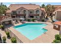 Inviting community pool features a gated fence, covered seating area, and a clear blue swimming space at 839 S Westwood -- # 154, Mesa, AZ 85210