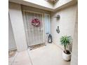 Charming entryway featuring a security door, decorative wreath, and potted plant at 16021 N 30Th St # 127, Phoenix, AZ 85032