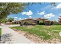 Attractive home with lush front lawn, mature landscaping, and a welcoming entrance at 20826 S Hadrian Way, Queen Creek, AZ 85142