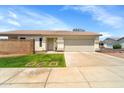 This single-story home includes a two-car garage, low maintenance landscaping, and neutral color palette at 2221 E Union Hills Dr # 148, Phoenix, AZ 85024