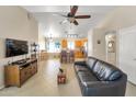 The living room includes an open floorplan, neutral color palette, and a ceiling fan at 2221 E Union Hills Dr # 148, Phoenix, AZ 85024