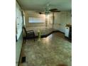 Bright and inviting living room features tile flooring, ceiling fan and large windows at 3104 E Broadway Rd # 295, Mesa, AZ 85204