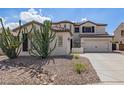 Two-story home featuring a neutral paint scheme, a three car garage, and desert landscaping at 3190 S Holguin Way, Chandler, AZ 85248