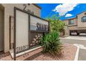 Community signage at The Shades with desert landscaping and a view of the modern townhomes at 3900 E Baseline Rd # 137, Phoenix, AZ 85042