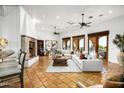 Spacious living room boasts a fireplace, high ceilings and natural light at 40039 N 107Th Pl, Scottsdale, AZ 85262