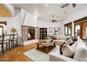 Inviting living room featuring a cozy fireplace and stylish furnishings at 40039 N 107Th Pl, Scottsdale, AZ 85262