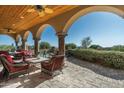Charming covered patio perfect for outdoor relaxation and entertaining at 40039 N 107Th Pl, Scottsdale, AZ 85262