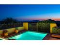 Enjoy the views from this inground pool featuring a tiled deck, secure iron fencing, and a peaceful spot to relax at 40039 N 107Th Pl, Scottsdale, AZ 85262