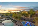 Desert backyard offers mountain views, pool, spa, and stained glass structure at 4281 S Tecoma Trl, Gold Canyon, AZ 85118