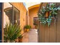 View through front gate to a charming walkway and front door at 4281 S Tecoma Trl, Gold Canyon, AZ 85118