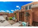 Charming townhome with a decorative front gate and a cozy, well-maintained yard at 4434 E Wood St, Phoenix, AZ 85040