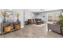A well-lit living room with neutral tones, cozy furniture, and decorative accents at 4645 E Covina St, Mesa, AZ 85205