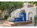 Charming courtyard with a tiled water fountain feature, adding a touch of elegance to the outdoor space at 5200 S Lakeshore Dr # 120, Tempe, AZ 85283