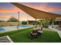 Lounge seating near a pickleball court highlights the outdoor recreation of this impressive desert property at 5630 E Peak View Rd, Cave Creek, AZ 85331