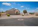 Charming single-story home showcasing neutral tones, a well-maintained yard, and convenient street access at 6550 S 24Th Pl, Phoenix, AZ 85042