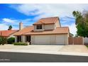 Well-maintained two-story home with a tile roof, a two-car garage, and low-maintenance landscaping at 7625 W Dreyfus Dr, Peoria, AZ 85381